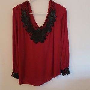 Red blouse with leather collar and sleeve